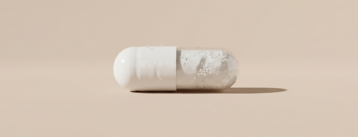 Magnesium supplement on beige background