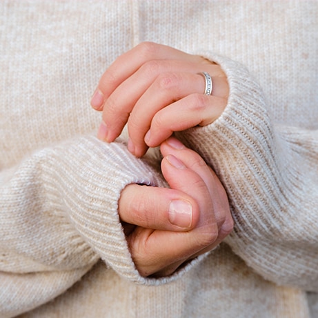 Close-up of female hands. Hand care in cold winter
