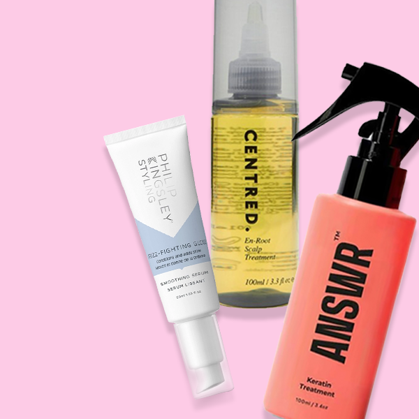 Selection of hair products on a pink background