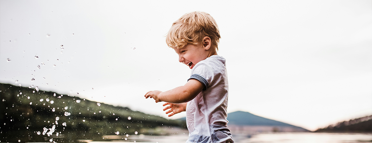 Boy playing outdoors in the lake