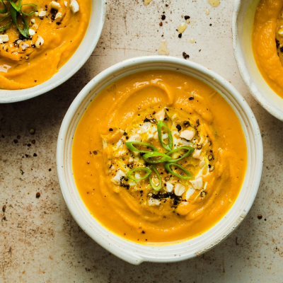 high fiber pumpkin soup on a darker background