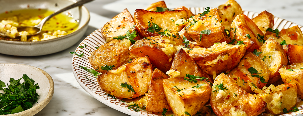 roast potatoes with sauce on a tray