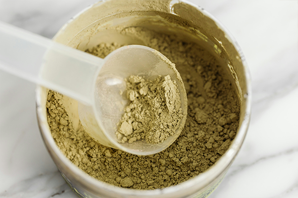 Protein powder in white tub