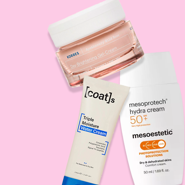 Selection of beauty products on pink background