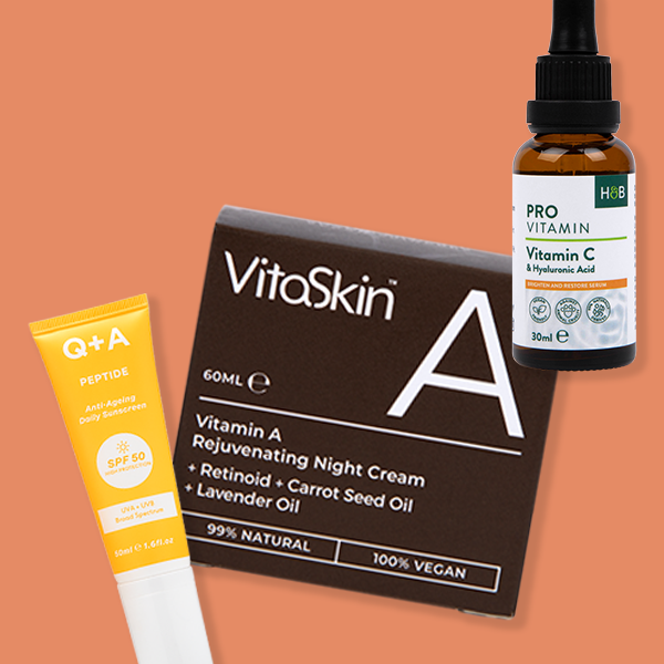 Selection of beauty products on orange background
