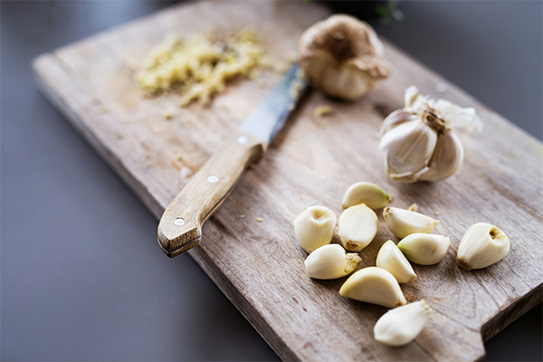 Garlic cloves on a chopping board