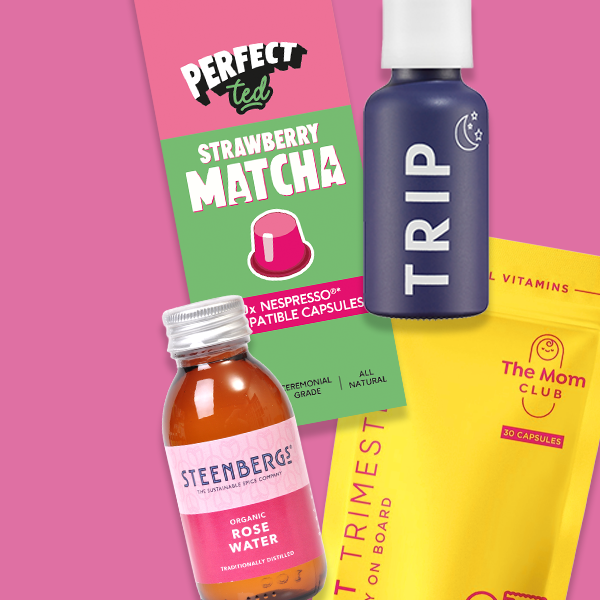Selection of beauty products on a pink background