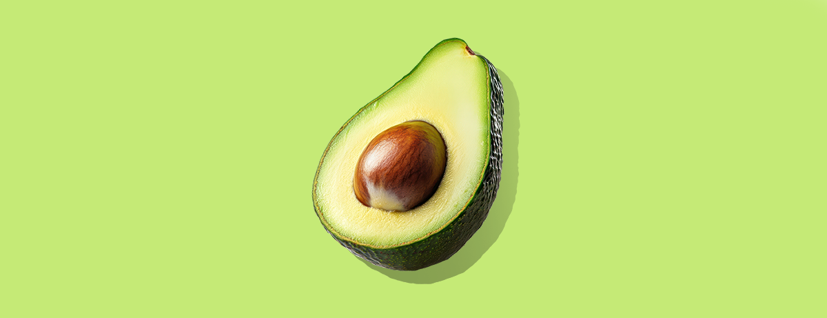 Avocado on light green background