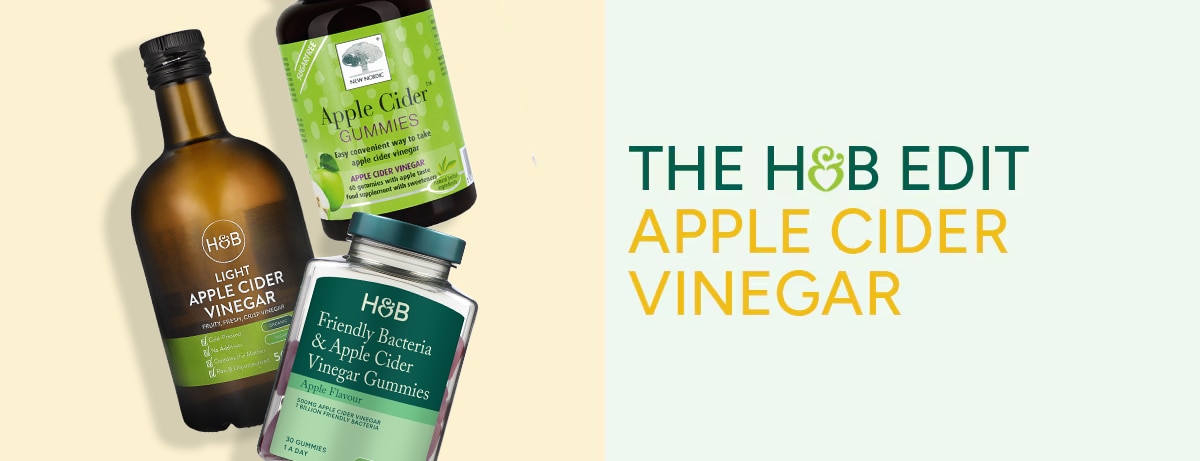 Selection of apple cider vinegar products on green background