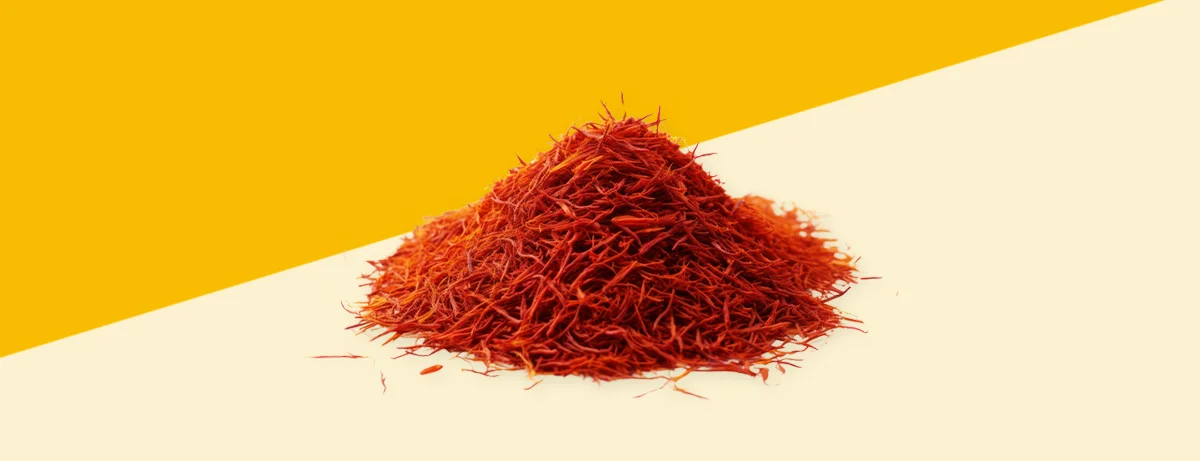 Pile of saffron on yellow background