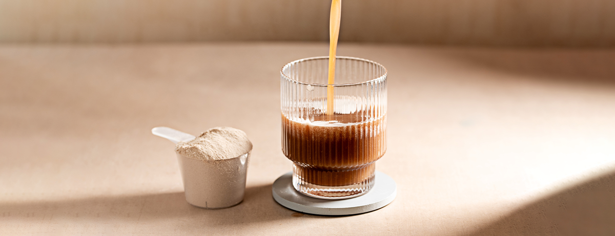 Protein shake being poured into a glass