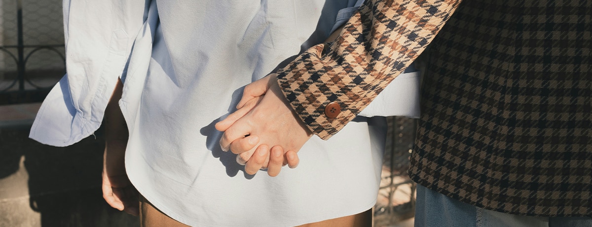 Couple holding hands