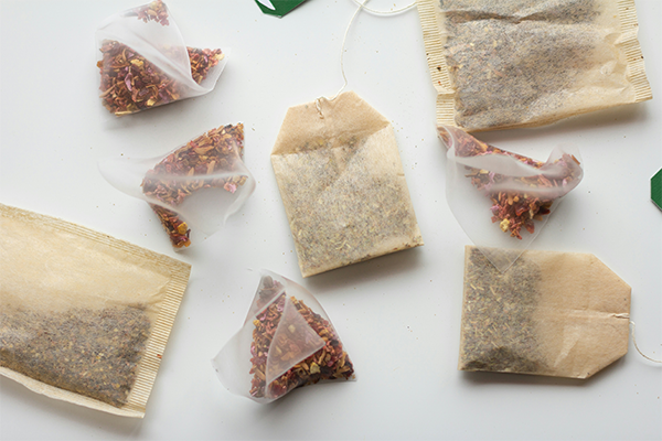 selection of fruit tea bags on white background