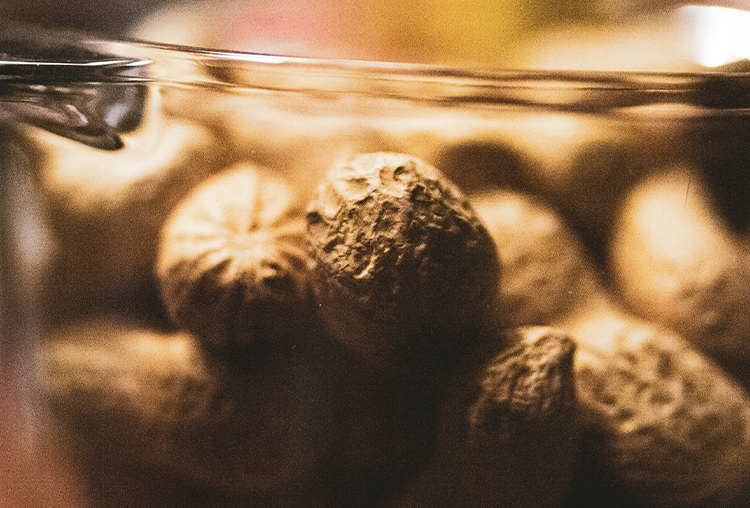 close up photograph of nuts and seeds in a bowl