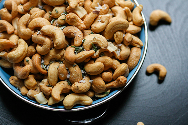 table salt food and drink nuts bowl cashew cashews food plant vegetable brown grain flora seed produce nut bean
