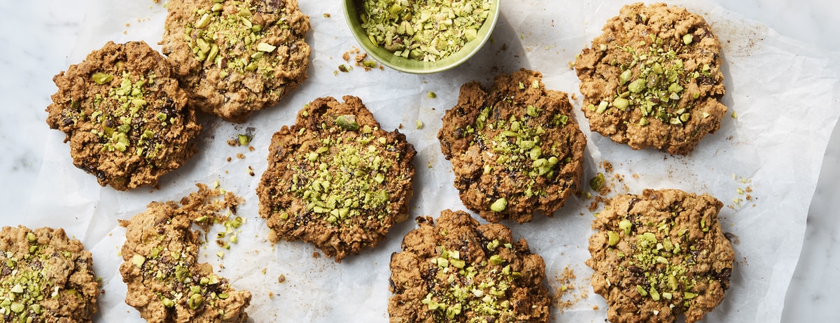 Dr Rupy's cookies with pistachios and apricots on a baking sheet