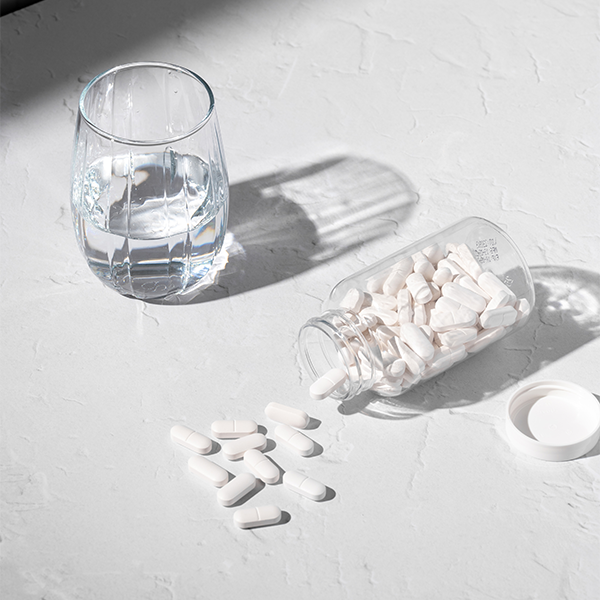 Selection of vitamins on white background