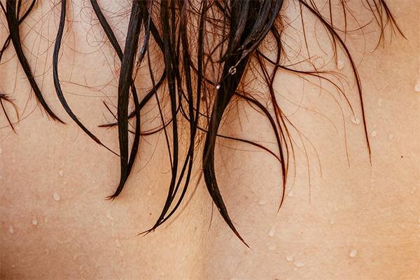 wet hair falling on back