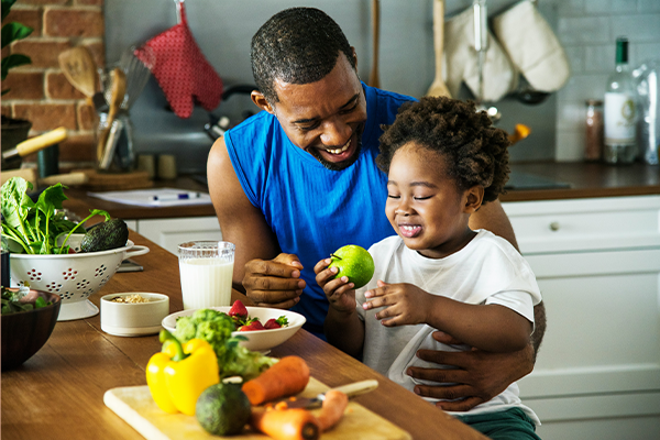 kitchen apple learning cooking healthy food child milk nutrition healthy lifestyle eating avocado wellbeing father and son diet strawberries spinach parenting dad childhood broccoli