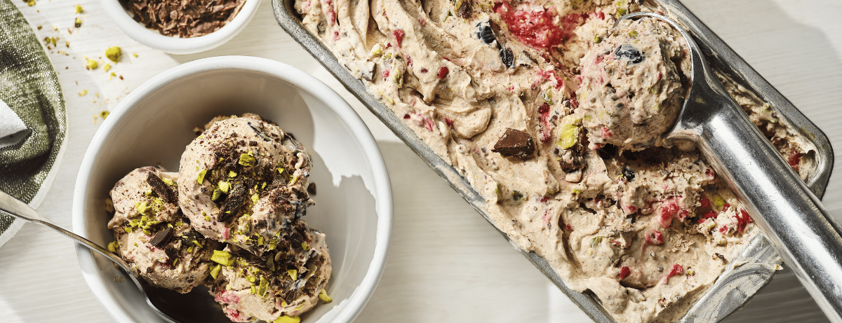 fro yo on a table with pistachio crumb