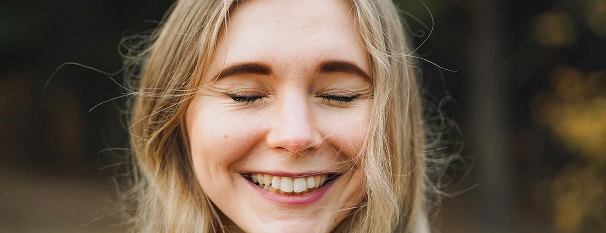 Female smiling close up at the camera