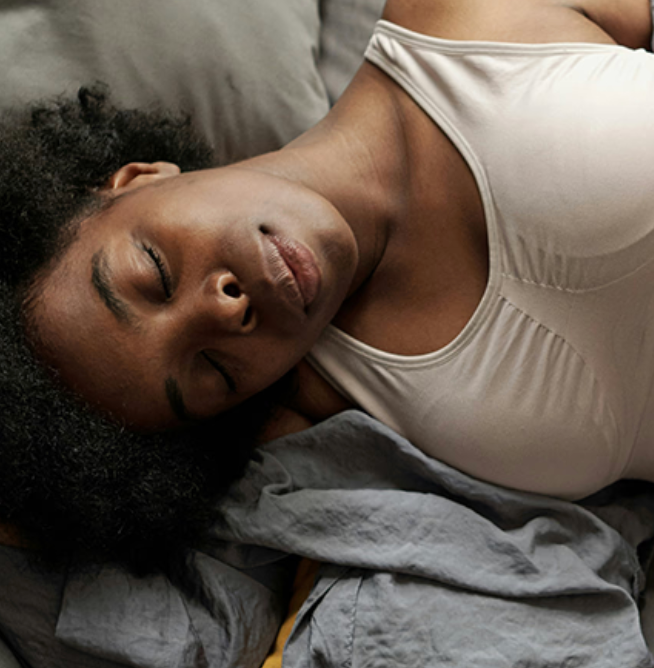 Female asleep in bed
