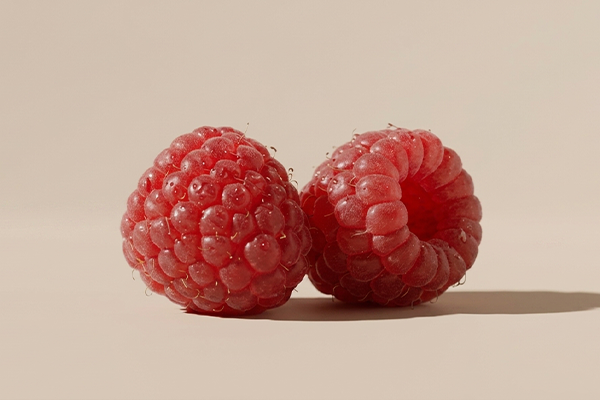Raspberry on pink background