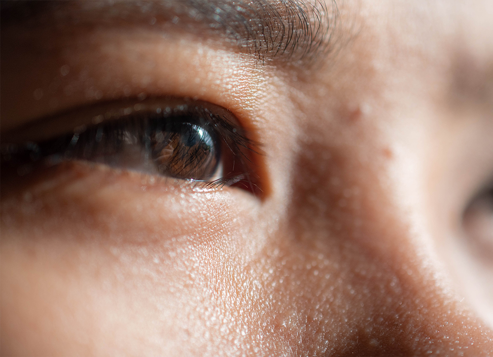 Close up of females eye, looks to have a smiling expression