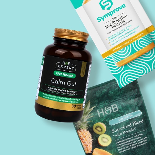 Gut health products scattered on a blue background