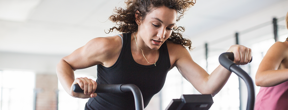 Female on rowing machine in the gym