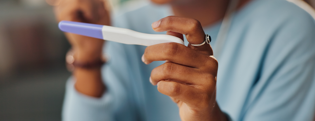 Female holding an ovulation test in her hands