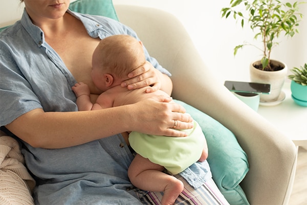 Mothed and baby, breastfeeding in laid back position