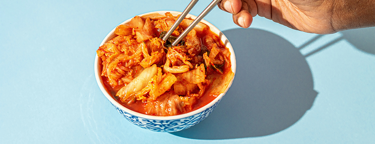 bowl of kimchi on a blue background