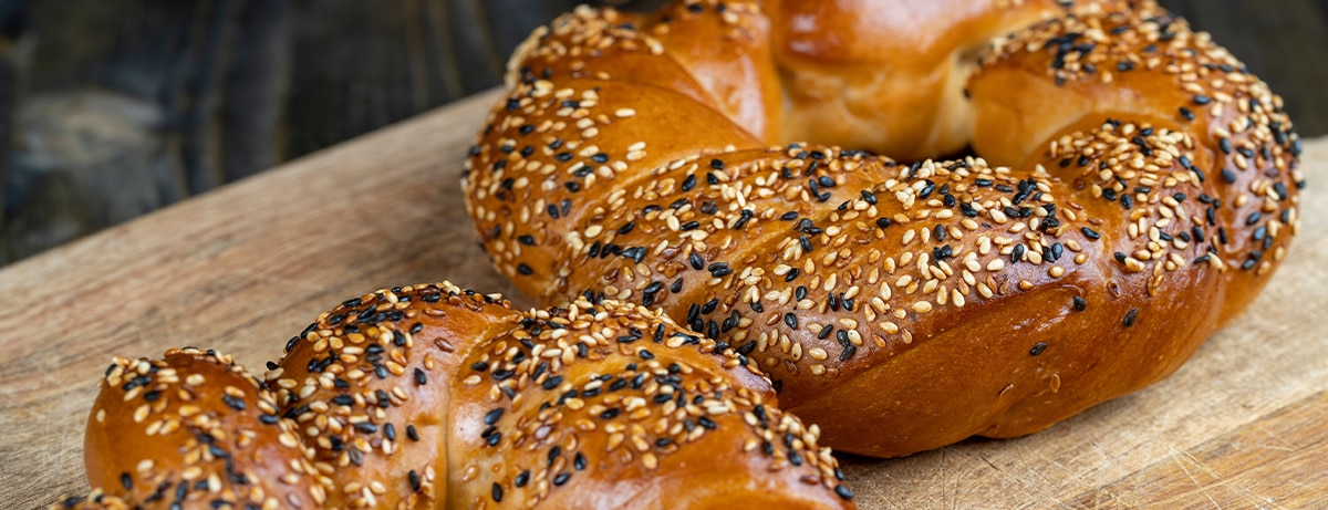 2 wheat bagles with sesame seeds sprinked on top