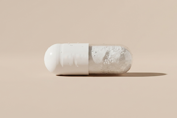 Magnesium supplement on beige background