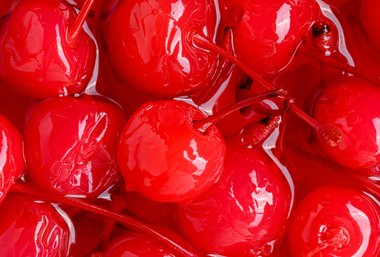 macro shot of red cherrie in liquid