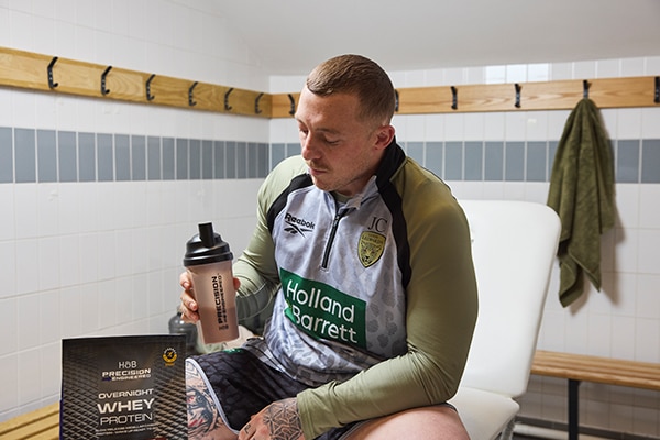 Rugby player sitting in changing room before match