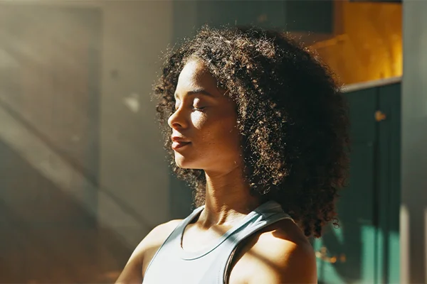 Female in the living room with calm expression