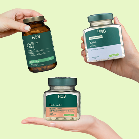 Pregnancy supplements on green background