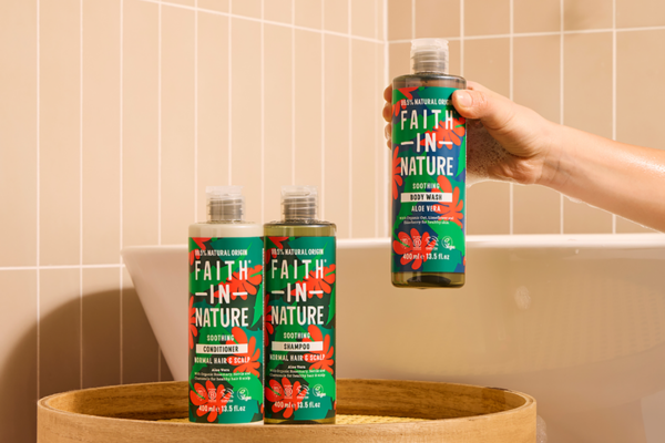 Person picking up an aloe vera faith in nature body wash