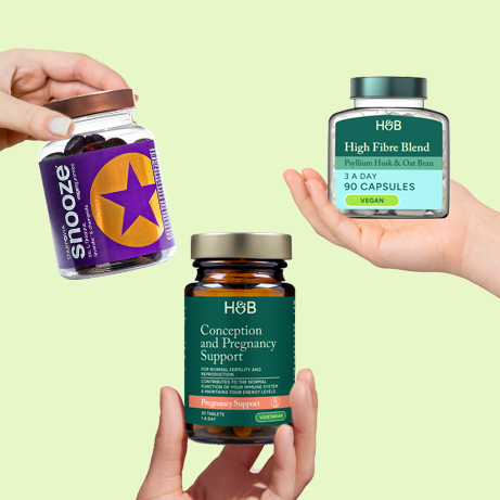Selection of vitamins on green background