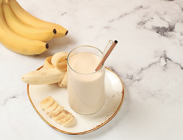 Banana vegan alternative milk lactose and gluten free, no allergies, healthy eating concept, maintaining healthy gut flora, diet food, weight loss, selective focus