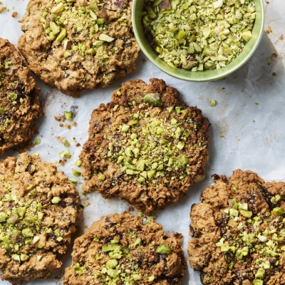 Dr Rupy's cookies with pistachios and apricots on a baking sheet