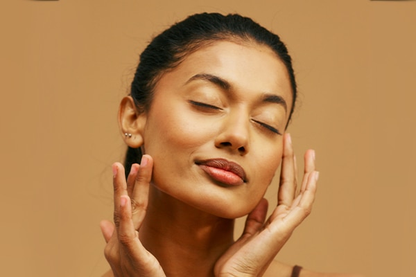 woman natural face model female beauty happy skincare skin studio skin care healthy indian clean fresh real long hair isolated posing ponytail