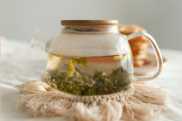 green white interior cafe tea table lemon carpet drinks steam teapot table cloth macrame morning vibes food usa chicago green tea