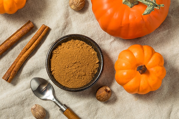 Pumpkin spices on a kitchen worktop background