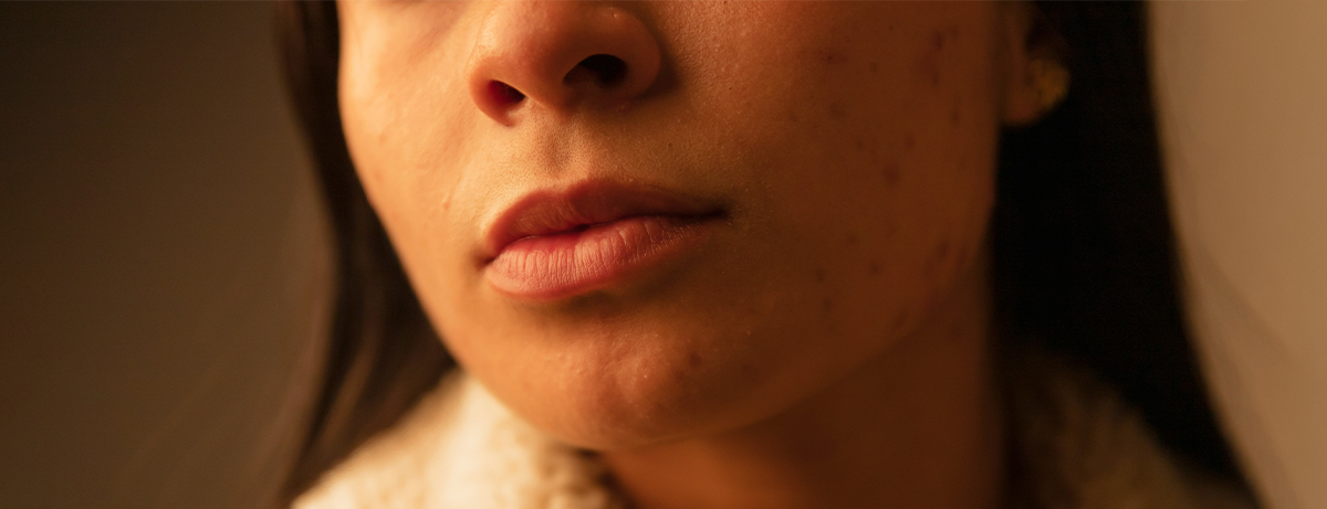 Close up of female, image focuses on mouth region