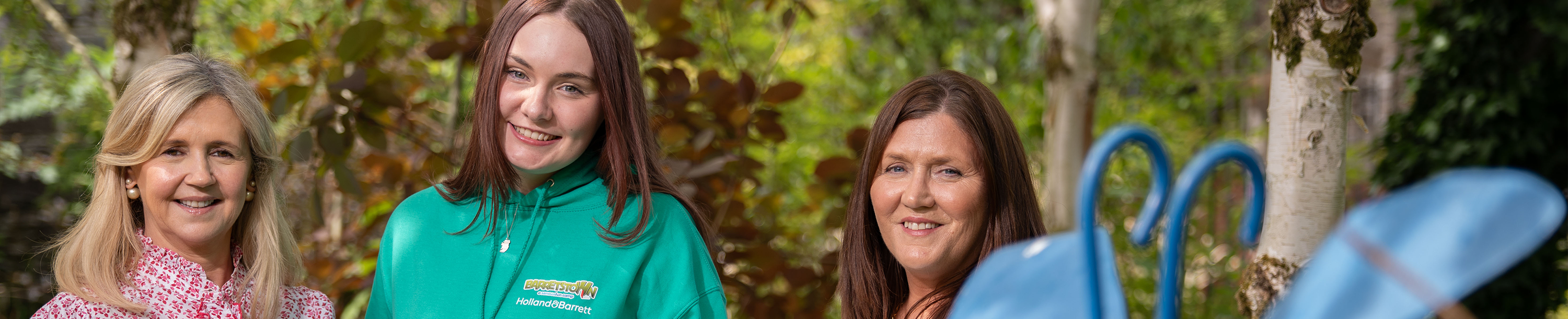 3 females standing in forest