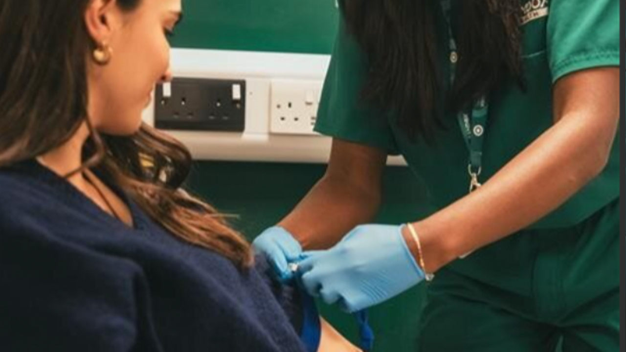 Female having blood test in clinic