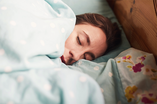 Female asleep in bed